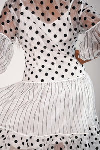 Black and white polka dot sheer dress with slip included. Tulle detail sleeves and necktie 