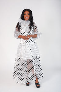 Black and white polka dot sheer dress with slip included. Tulle detail sleeves and necktie 